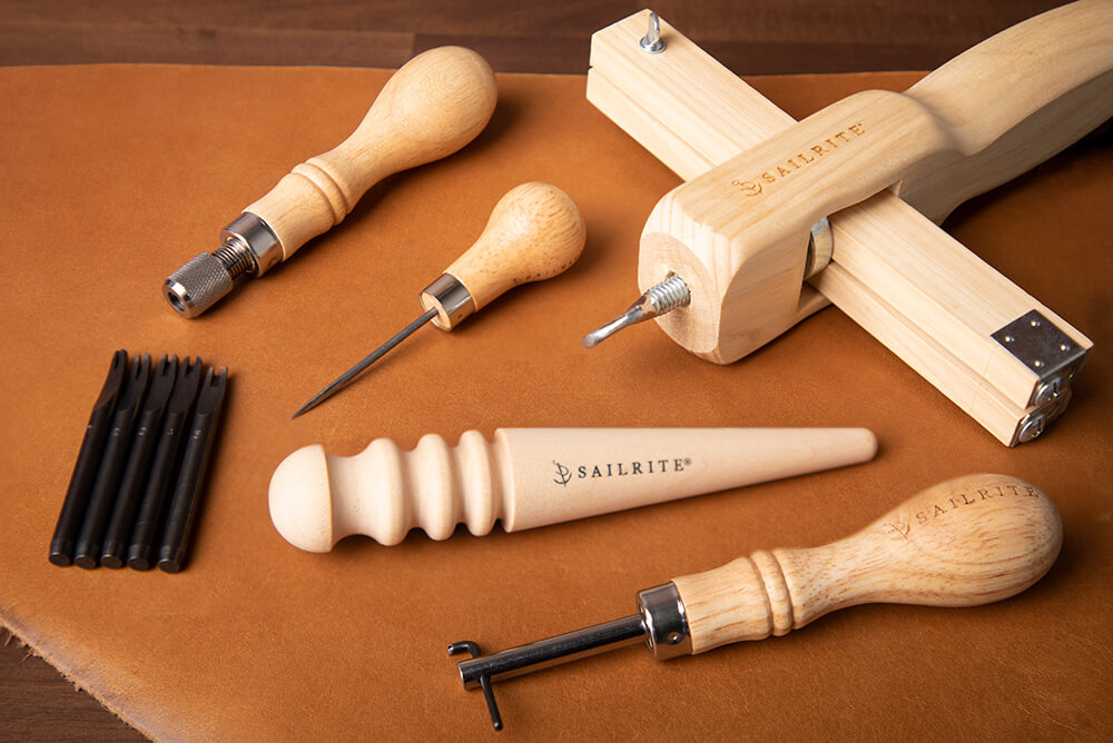 A scratch awl, a strap cutter, edge beveler and more are all good tools for a leatherworker to keep on their workbench.